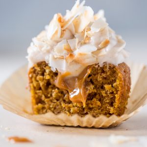 Moist and fluffy Pumpkin Coconut Cupcakes are stuffed with decadent Dulce de Ceche and covered in cinnamon cream cheese frosting! So delicious!
