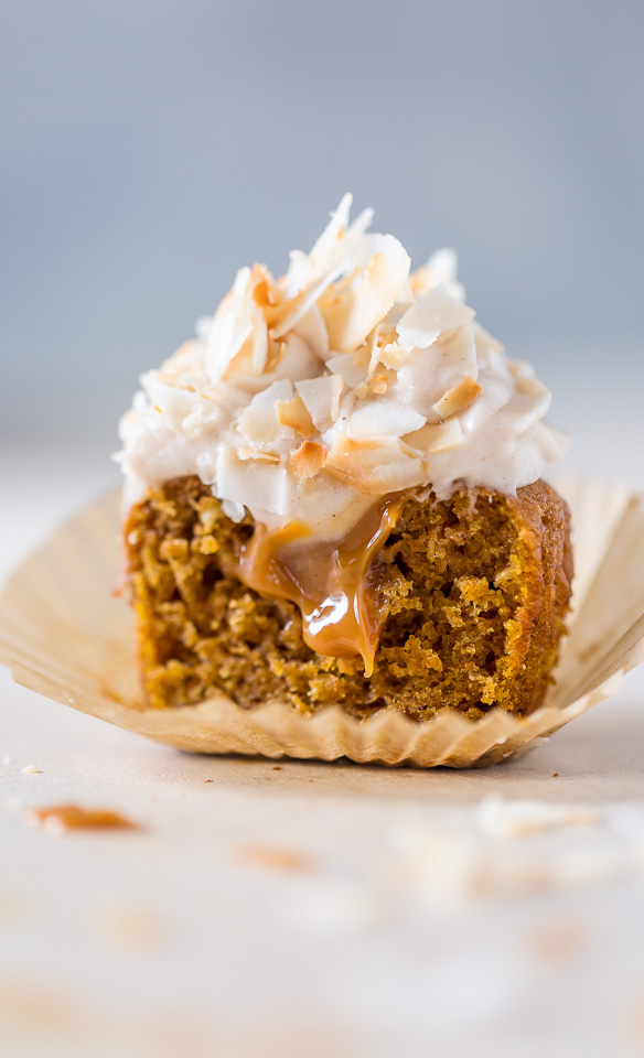 Moist and fluffy Pumpkin Coconut Cupcakes are stuffed with decadent Dulce de Ceche and covered in cinnamon cream cheese frosting! So delicious!