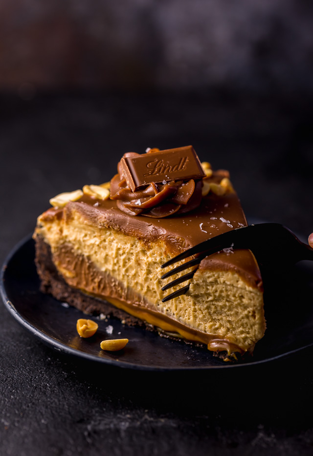 Slice of peanut butter pie with a fork slicing into it.