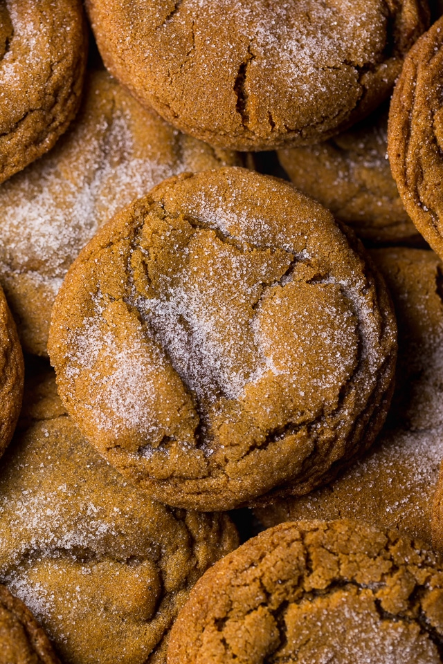 Molasses cookies rolled in white sugar piled on top of each other.