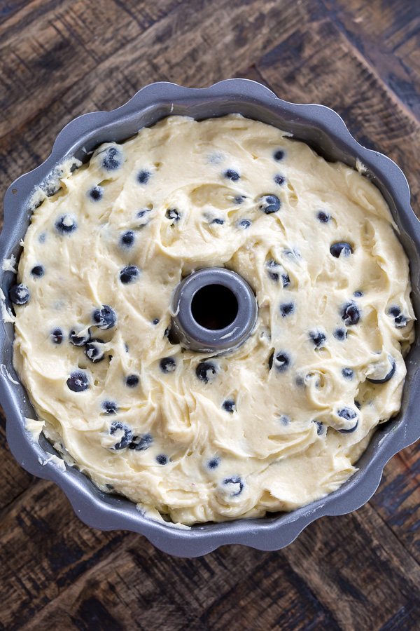 An easy and delicious recipe for The BEST Blueberry Bundt Cake! This cake is so moist, buttery, and bursting with juicy blueberries! It's perfect for brunch and pairs well with coffee or tea.