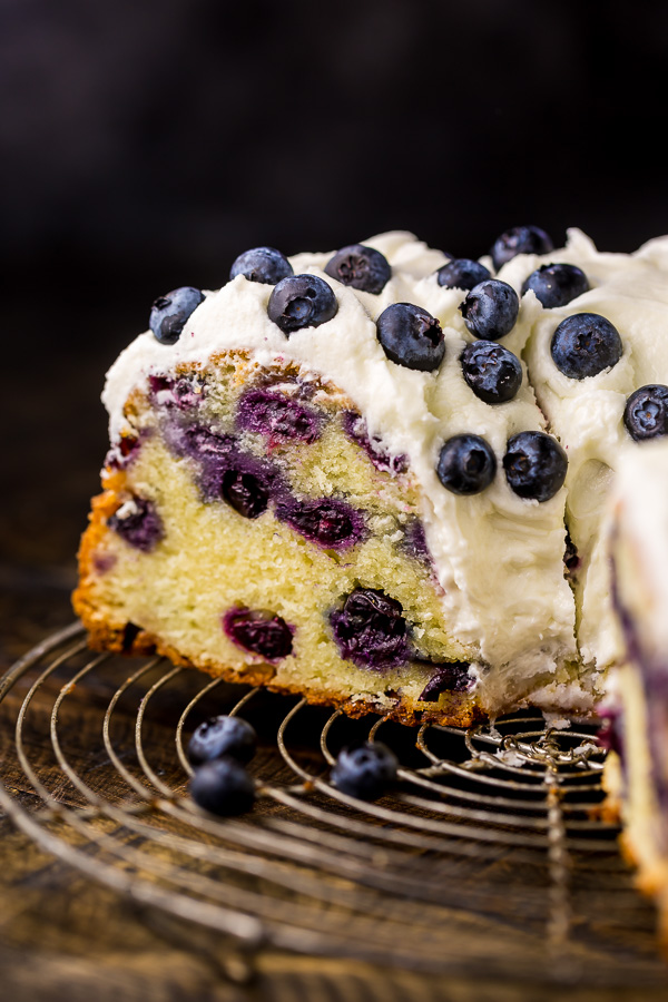 An easy and delicious recipe for The BEST Blueberry Bundt Cake! This cake is so moist, buttery, and bursting with juicy blueberries! It's perfect for brunch and pairs well with coffee or tea.