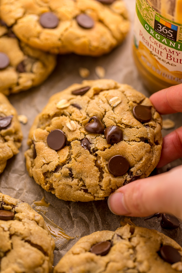 These Peanut Butter Oatmeal Chocolate Chip Cookies are so thick and chewy! Loaded with creamy peanut butter flavor, old-fashioned oats, and chocolate chips, these are a must try for peanut butter lovers! You don't have to chill the cookie dough, which makes this recipe quick and easy to bake.