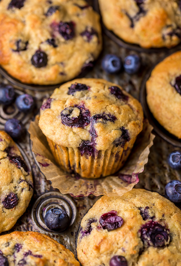 Healthy Greek Yogurt and Honey Blueberry Muffins are moist, fluffy, and subtly sweet! We love this healthy blueberry muffin recipe for breakfast or as a snack! The protein packed Greek yogurt makes these muffins moist and the honey makes them delightfully sweet.