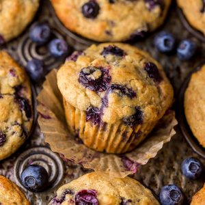 Healthy Greek Yogurt and Honey Blueberry Muffins are moist, fluffy, and subtly sweet! We love this healthy blueberry muffin recipe for breakfast or as a snack! The protein packed Greek yogurt makes these muffins moist and the honey makes them delightfully sweet.