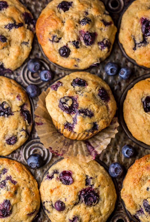 Healthy Greek Yogurt and Honey Blueberry Muffins are moist, fluffy, and subtly sweet! We love this healthy blueberry muffin recipe for breakfast or as a snack! The protein packed Greek yogurt makes these muffins moist and the honey makes them delightfully sweet.