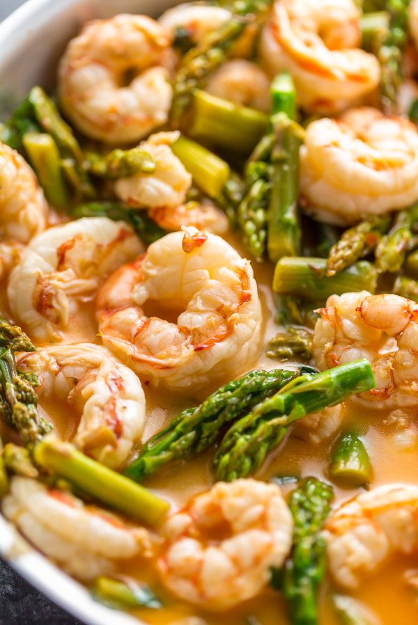 This quick and easy Lemon Garlic Shrimp and Asparagus is ready in less than 20 minutes! This one pan meal is exploding with flavor and always a crowd-pleaser. So next time you're looking for a healthy dinner, give this garlic shrimp and asparagus a try!