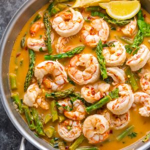 This quick and easy Lemon Garlic Shrimp and Asparagus is ready in less than 20 minutes! This one pan meal is exploding with flavor and always a crowd-pleaser. So next time you're looking for a healthy dinner, give this garlic shrimp and asparagus a try!