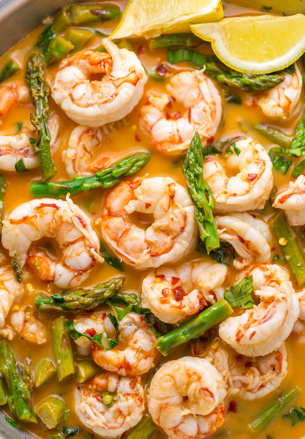 This quick and easy Lemon Garlic Shrimp and Asparagus is ready in less than 20 minutes! This one pan meal is exploding with flavor and always a crowd-pleaser. So next time you're looking for a healthy dinner, give this garlic shrimp and asparagus a try!