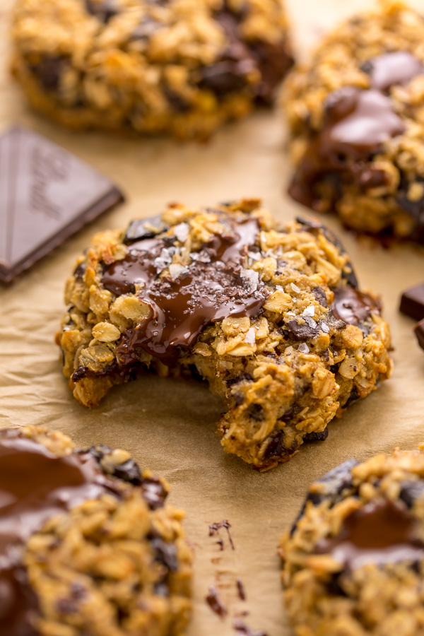 These Gluten Free Oatmeal Cookies are soft yet crunchy and loaded with gooey chocolate! Made with gluten free oats, almond flour, and shredded coconut, these cookies are completely gluten free. So delicious with a glass of milk!