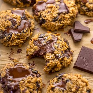 These Gluten Free Oatmeal Cookies are soft yet crunchy and loaded with gooey chocolate! Made with gluten free oats, almond flour, and shredded coconut, these cookies are completely gluten free. So delicious with a glass of milk!
