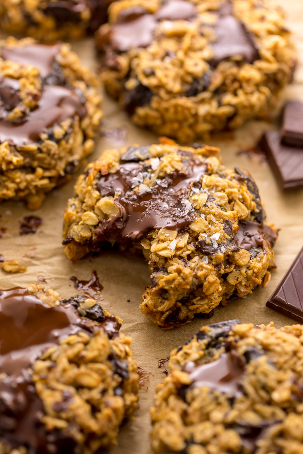 These Gluten Free Oatmeal Cookies are soft yet crunchy and loaded with gooey chocolate! Made with gluten free oats, almond flour, and shredded coconut, these cookies are completely gluten free. So delicious with a glass of milk!
