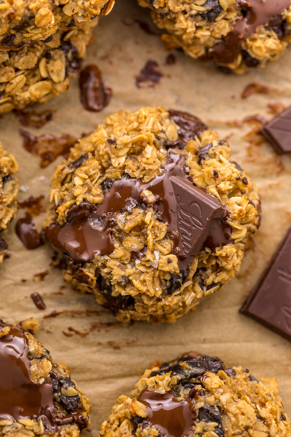 These Gluten Free Oatmeal Cookies are soft yet crunchy and loaded with gooey chocolate! Made with gluten free oats, almond flour, and shredded coconut, these cookies are completely gluten free. So delicious with a glass of milk!