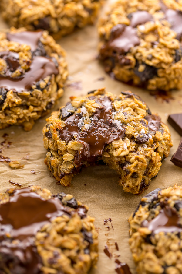These Gluten Free Oatmeal Cookies are soft yet crunchy and loaded with gooey chocolate! Made with gluten free oats, almond flour, and shredded coconut, these cookies are completely gluten free. So delicious with a glass of milk!