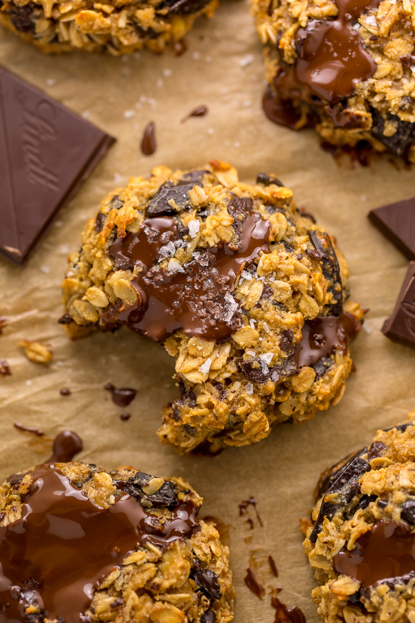 These Gluten Free Oatmeal Cookies are soft yet crunchy and loaded with gooey chocolate! Made with gluten free oats, almond flour, and shredded coconut, these cookies are completely gluten free. So delicious with a glass of milk!