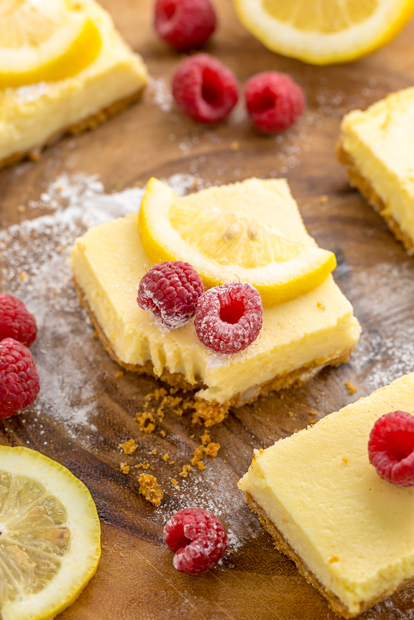 These Lemon Pie Bars are made with lemon juice, lemon zest, and lemon extract, so you know they're loaded with lemon flavor! Sprinkle each bar with powdered sugar and serve with fresh raspberries. Anyone who loves lemon should try this easy lemon dessert!!!