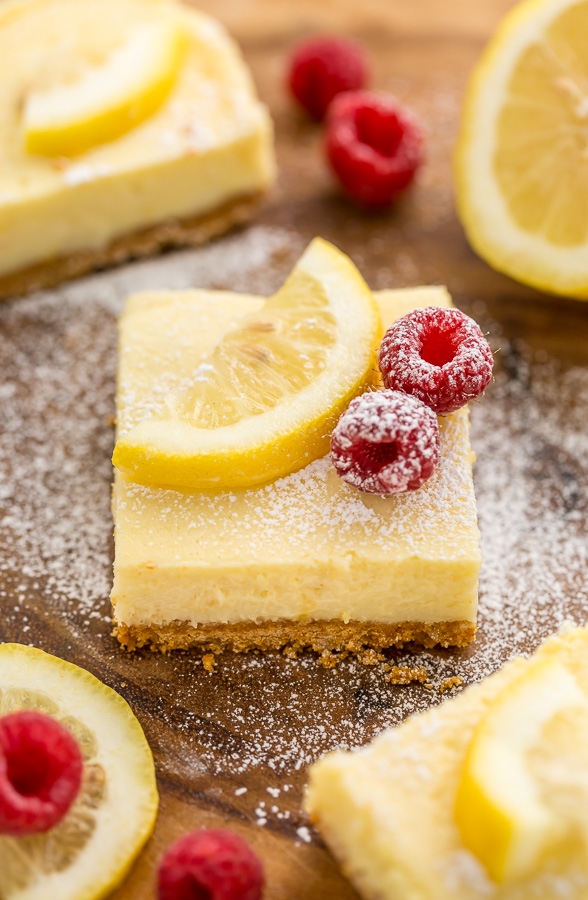 These Lemon Pie Bars are made with lemon juice, lemon zest, and lemon extract, so you know they're loaded with lemon flavor! Sprinkle each bar with powdered sugar and serve with fresh raspberries. Anyone who loves lemon should try this easy lemon dessert!!!