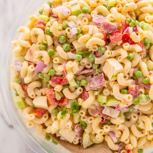 This Easy Italian Macaroni Salad Recipe features elbow noodles, bell peppers, celery, onion, sharp provolone, and salami! And the dressing is so creamy and flavorful! This is the perfect macaroni salad for parties, picnics, and backyard bbqs.