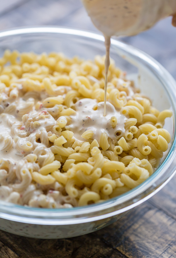 This Easy Italian Macaroni Salad Recipe features elbow noodles, bell peppers, celery, onion, sharp provolone, and salami! And the dressing is so creamy and flavorful! This is the perfect macaroni salad for parties, picnics, and backyard bbqs.