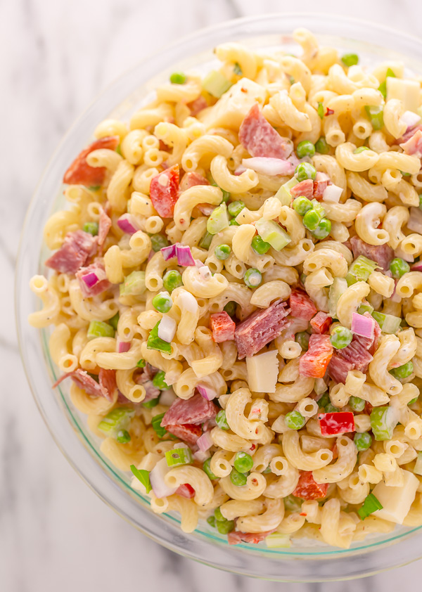 This Easy Italian Macaroni Salad Recipe features elbow noodles, bell peppers, celery, onion, sharp provolone, and salami! And the dressing is so creamy and flavorful! This is the perfect macaroni salad for parties, picnics, and backyard bbqs.