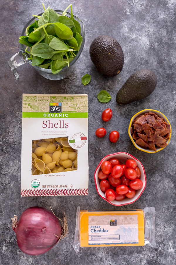 This Creamy Avocado BLT Pasta Salad is so easy and perfect for Summer celebrations! Loaded with crispy bacon, juicy tomatoes, spinach, avocado, and cheddar cheese. This flavorful pasta salad is always a crowd-pleaser!