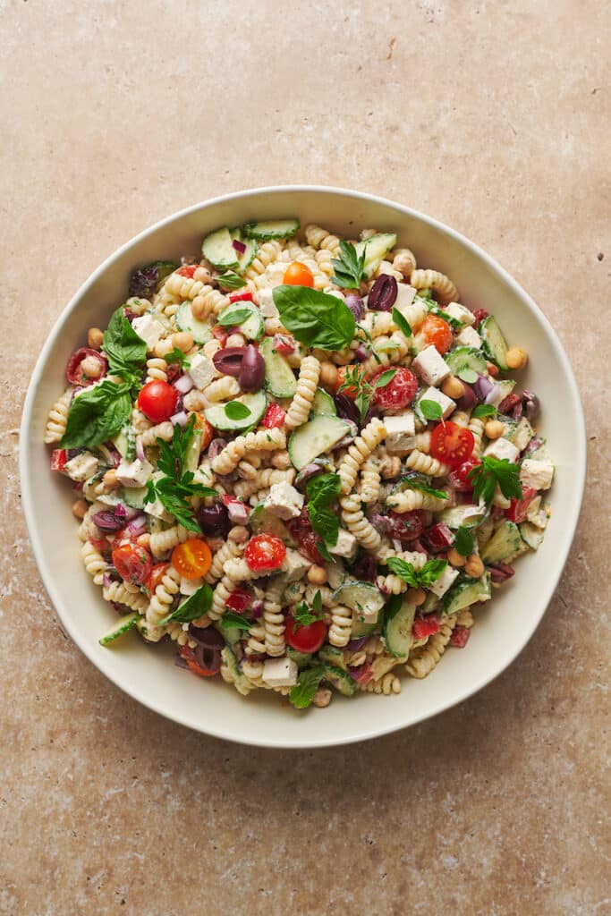 White bowl with pasta salad inside.