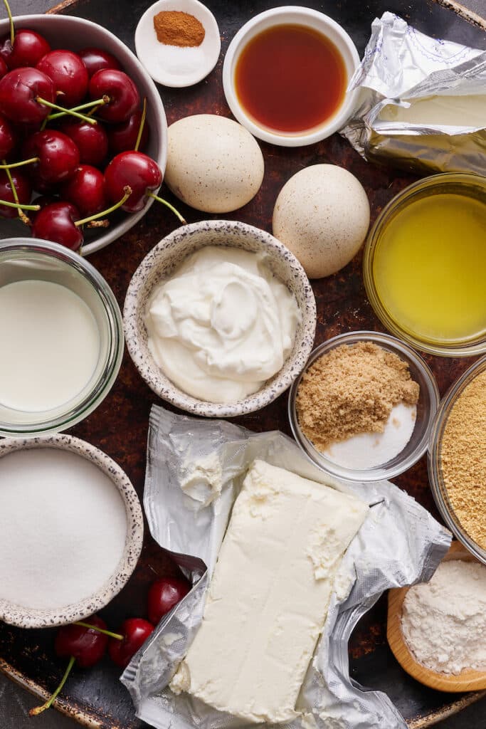 Ingredients for mini cheesecake recipe on large plate.