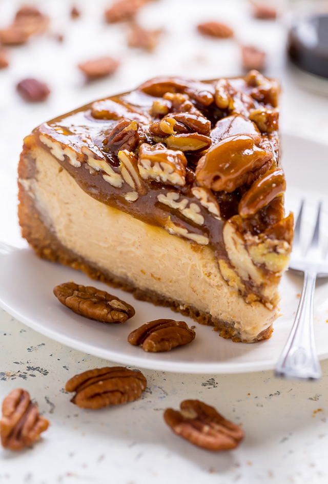 Slice of pecan pie cheesecake on plate.