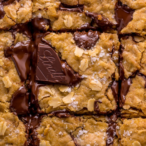 These are the BEST Oatmeal Cookie Bars you'll ever bake! Soft, chewy, and loaded with rolled oats and chocolate, this is a great recipe the whole family will love! Super easy and no mixer required!