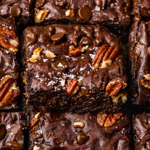 These Bourbon Pecan Brownies are going to blow your mind! They're thick, insanely chewy, and loaded with crunchy pecans, a pinch of cinnamon, and flavorful bourbon! The ultimate special occasion brownie recipe!