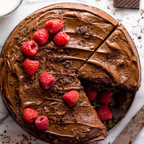 This Easy Single Layer Chocolate Cake is utterly moist and topped with melt-in-your-mouth Chocolate Frosting! The perfect dessert for date night in, small birthday celebrations, and intimate gatherings. And no electric mixer required!