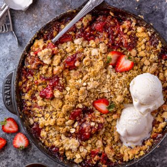 This Easy Strawberry Crisp is the perfect Summer dessert! Featuring plenty of juicy strawberries and a golden brown oatmeal crisp topping, it's best served warm... with a big scoop of vanilla ice cream on top! Can be made with fresh or frozen strawberries!