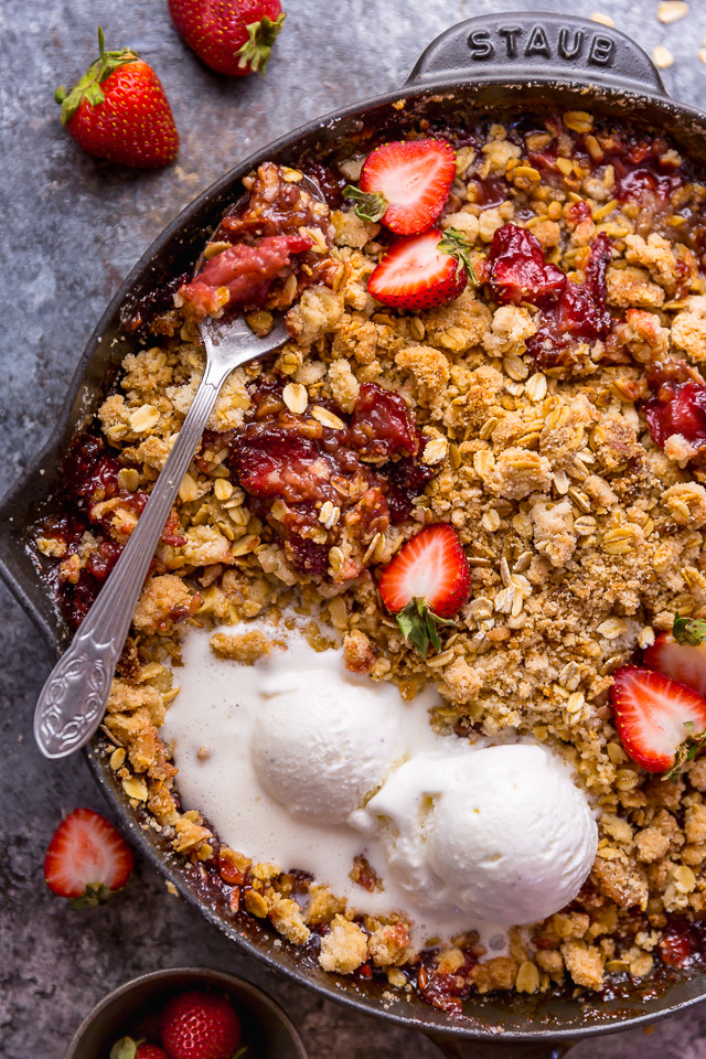 This Easy Strawberry Crisp is the perfect Summer dessert! Featuring plenty of juicy strawberries and a golden brown oatmeal crisp topping, it's best served warm... with a big scoop of vanilla ice cream on top! Can be made with fresh or frozen strawberries!