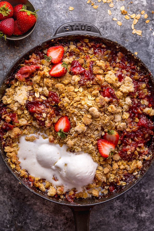 This Easy Strawberry Crisp is the perfect Summer dessert! Featuring plenty of juicy strawberries and a golden brown oatmeal crisp topping, it's best served warm... with a big scoop of vanilla ice cream on top! Can be made with fresh or frozen strawberries!