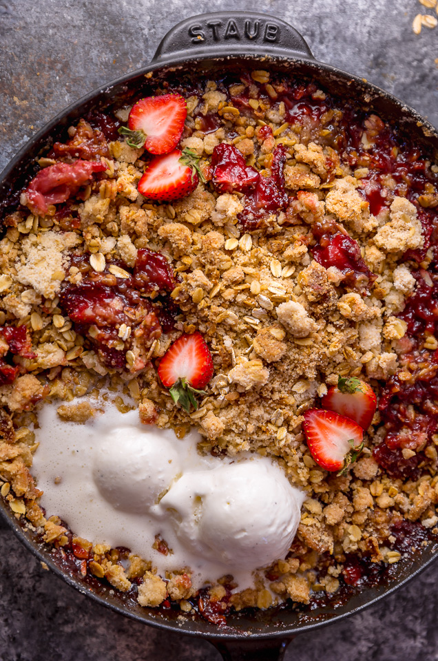 This Easy Strawberry Crisp is the perfect Summer dessert! Featuring plenty of juicy strawberries and a golden brown oatmeal crisp topping, it's best served warm... with a big scoop of vanilla ice cream on top! Can be made with fresh or frozen strawberries!