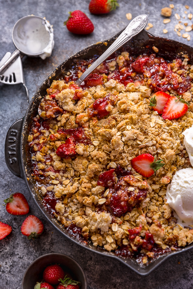 This Easy Strawberry Crisp is the perfect Summer dessert! Featuring plenty of juicy strawberries and a golden brown oatmeal crisp topping, it's best served warm... with a big scoop of vanilla ice cream on top! Can be made with fresh or frozen strawberries!