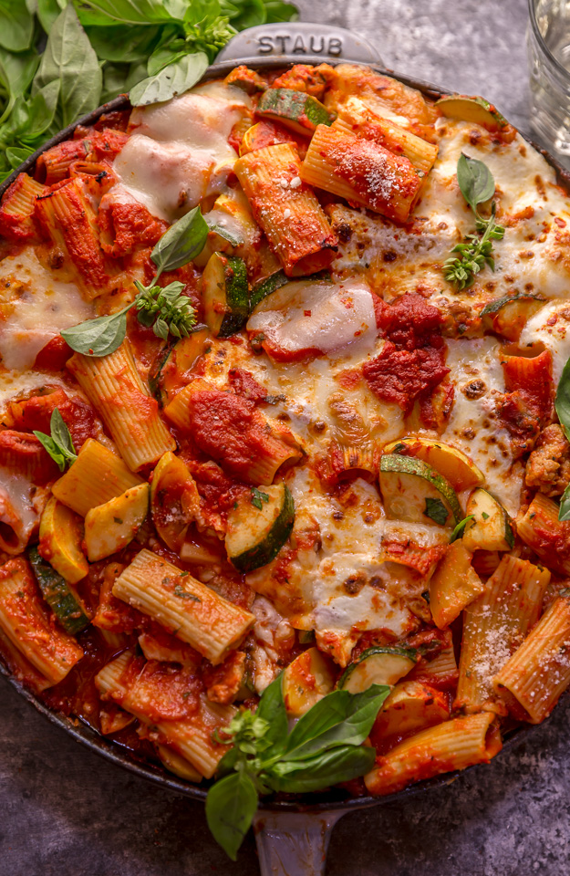 Preheat your oven to 350, because we're making Baked Rigatoni Fra Diavolo with Sausage and Zucchini for dinner tonight! Featuring a spicy tomato sauce loaded with fresh herbs, Italian sausage, tender zucchini, and tons of gooey cheese! This is Summer comfort food at its best!