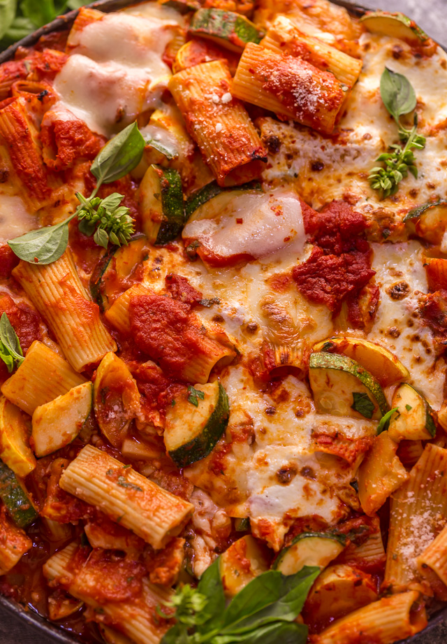 Preheat your oven to 350, because we're making Baked Rigatoni Fra Diavolo with Sausage and Zucchini for dinner tonight! Featuring a spicy tomato sauce loaded with fresh herbs, Italian sausage, tender zucchini, and tons of gooey cheese! This is Summer comfort food at its best!