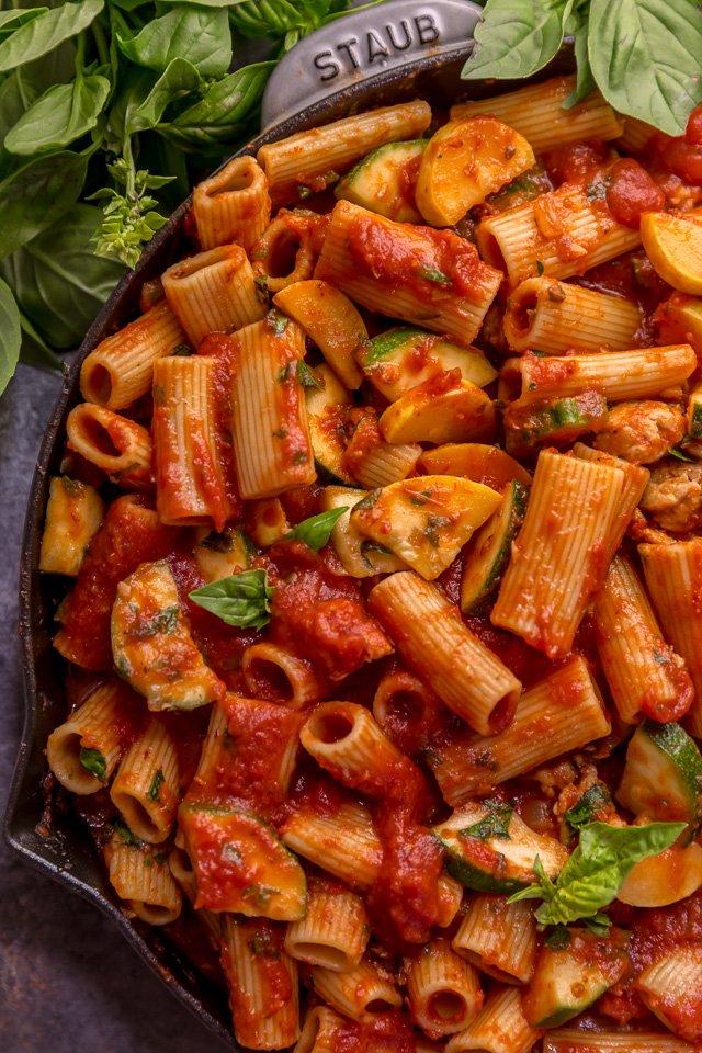 Preheat your oven to 350, because we're making Baked Rigatoni Fra Diavolo with Sausage and Zucchini for dinner tonight! Featuring a spicy tomato sauce loaded with fresh herbs, Italian sausage, tender zucchini, and tons of gooey cheese! This is Summer comfort food at its best!