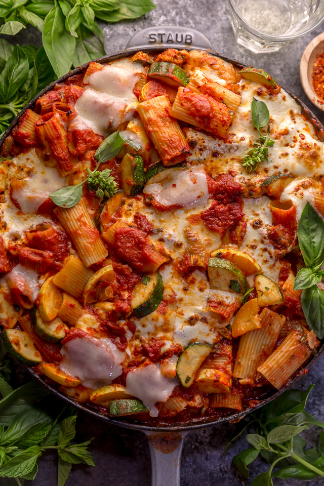 Preheat your oven to 350, because we're making Baked Rigatoni Fra Diavolo with Sausage and Zucchini for dinner tonight! Featuring a spicy tomato sauce loaded with fresh herbs, Italian sausage, tender zucchini, and tons of gooey cheese! This is Summer comfort food at its best!