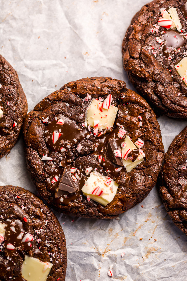 If you enjoy the combination of dark chocolate and perky peppermint, you're going to LOVE these Double Chocolate Peppermint Fudge Cookies! Topped with gooey chocolate chunks, a white chocolate layer, plus crushed candy canes, these cookies are as beautiful as they are delicious! And a must bake this holiday season!
