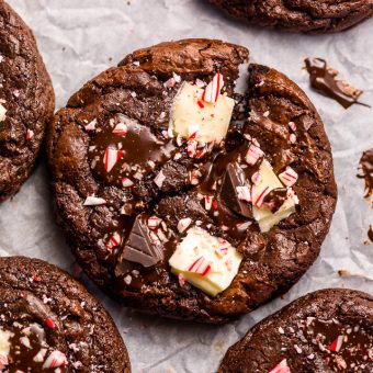 If you enjoy the combination of dark chocolate and perky peppermint, you're going to LOVE these Double Chocolate Peppermint Fudge Cookies! Topped with gooey chocolate chunks, a white chocolate layer, plus crushed candy canes, these cookies are as beautiful as they are delicious! And a must bake this holiday season!