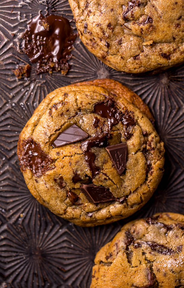 Whiskey lovers will go crazy for these Rye Whiskey Chocolate Chip Cookies! Made with a unique combination of rye flour and all purpose flour, they bake up soft, chewy, and ultra thick! Brown butter, rye whiskey, and plenty of chocolate make these grown up chocolate chip cookies totally irresistible!