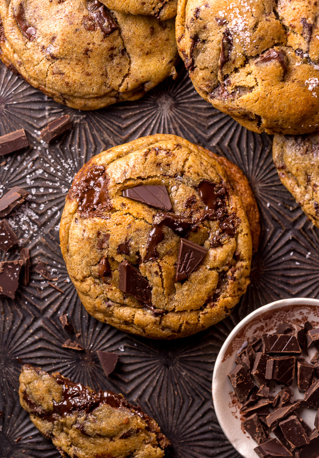 Whiskey lovers will go crazy for these Rye Whiskey Chocolate Chip Cookies! Made with a unique combination of rye flour and all purpose flour, they bake up soft, chewy, and ultra thick! Brown butter, rye whiskey, and plenty of chocolate make these grown up chocolate chip cookies totally irresistible!