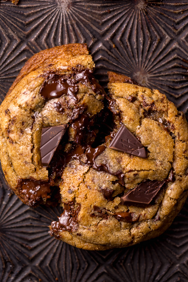 Whiskey lovers will go crazy for these Rye Whiskey Chocolate Chip Cookies! Made with a unique combination of rye flour and all purpose flour, they bake up soft, chewy, and ultra thick! Brown butter, rye whiskey, and plenty of chocolate make these grown up chocolate chip cookies totally irresistible!