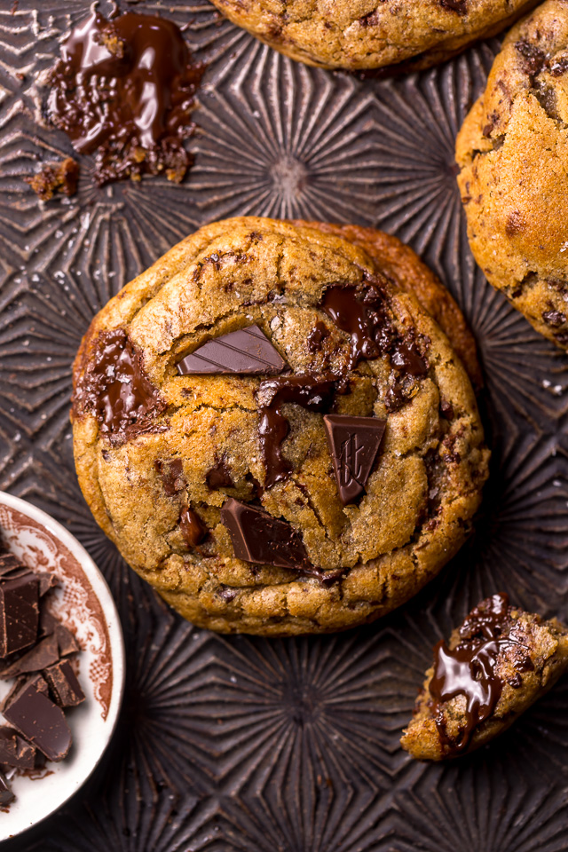 Whiskey lovers will go crazy for these Rye Whiskey Chocolate Chip Cookies! Made with a unique combination of rye flour and all purpose flour, they bake up soft, chewy, and ultra thick! Brown butter, rye whiskey, and plenty of chocolate make these grown up chocolate chip cookies totally irresistible!