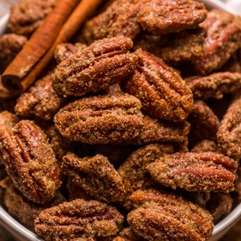 These EASY Candied Pecans are sweet, crunchy, and borderline addictive! Made with simple ingredients, these candied nuts are delicious on salads, ice cream, yogurt, casseroles, or just by the handful! Store in an airtight container and they'll last up to two weeks!