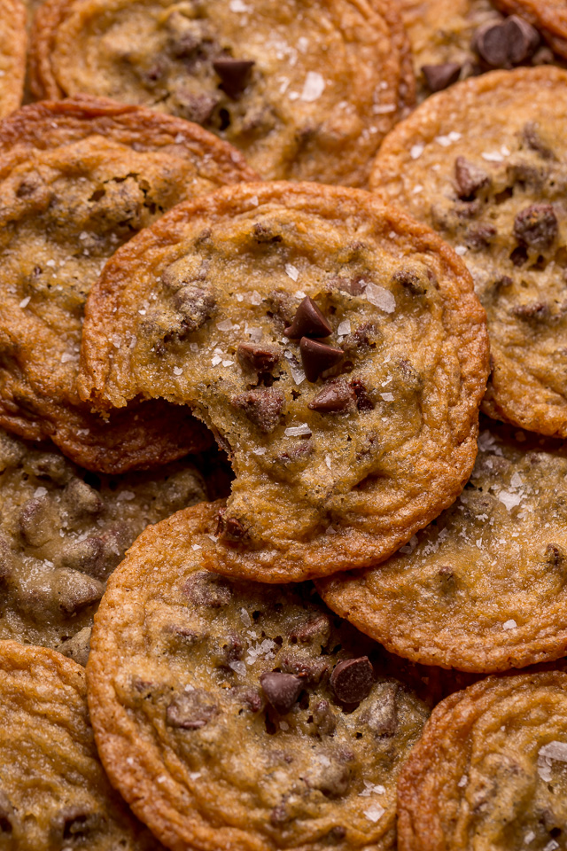 Bust out your cookie sheet, because these thin crispy chocolate chip cookies are a must bake! These cookies bake up golden brown and smell like heaven! Super thin and delightful crisp, these are one of our favorite chocolate chip cookie recipes!