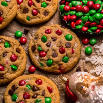 Santa's Favorite Peanut Butter M&M Cookies are thick, soft, and chewy! These GIANT bakery-style holiday cookies are loaded with peanut butter, M&Ms, and gooey milk chocolate chips! A crowd-pleasing cookie recipe that's loved equally by kiddos and adults!