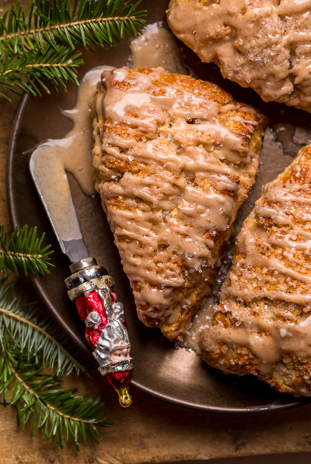These Bakery-Style Eggnog Scones are flaky, buttery, and loaded with eggnog flavor! Topped with a sweet eggnog glaze, they're perfect for Christmas morning! Best served warm, with a cup of coffee or tea!